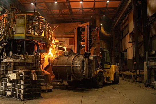 A Hyster lift truck carries equipment to collect molten steel